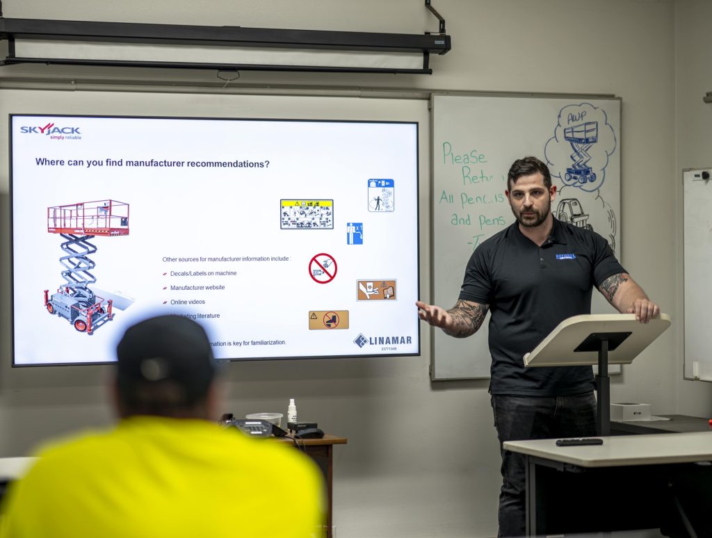 trainer in a classroom at National Lift Truck teaching Operator Training for forklifts and MEWPs (mobile elevated work platforms)