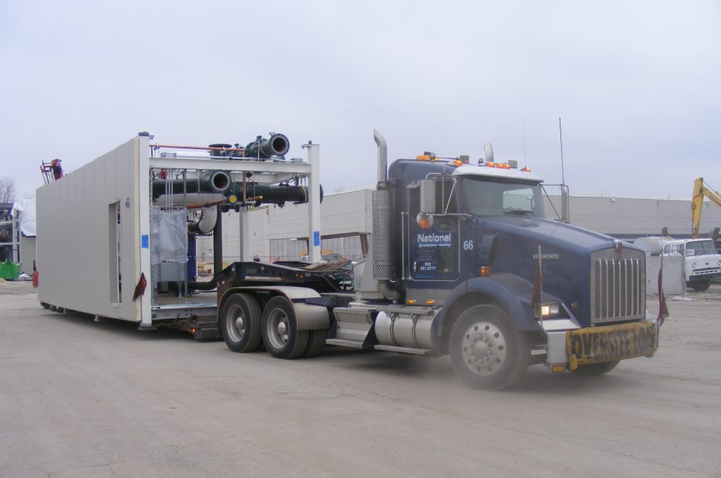 National Specialized Hauling truck hauling oversize load of industrial equipment