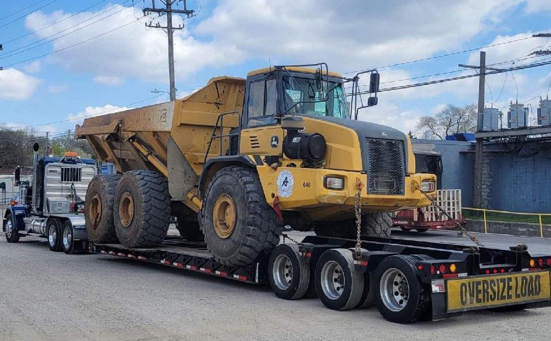 oversize construction equipment being hauled by National Specialized Hauling