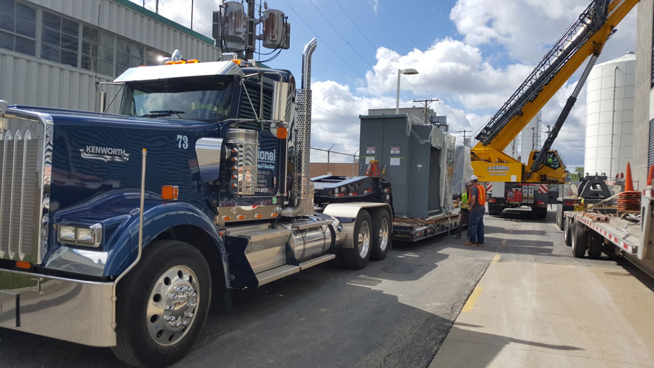 local trucking for oversize equipment on construction site