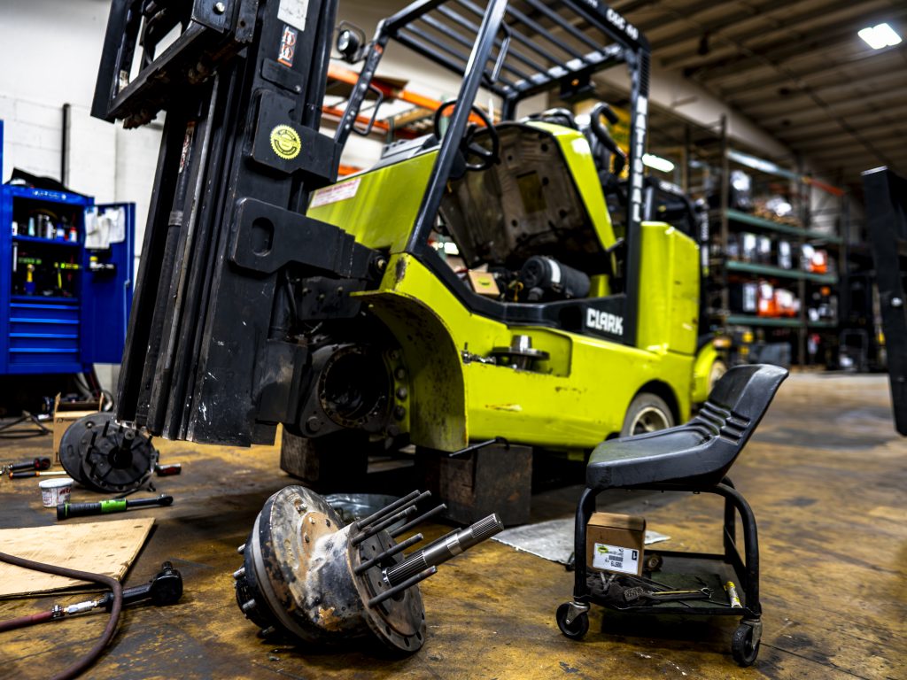 Disassembled forklift being repaired at National Lift Truck Chicago